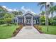 Community clubhouse with welcoming entrance, landscaping, and convenient features at 2956 Lucayan Harbour Cir # 107, Kissimmee, FL 34746