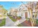 Side view of the home showcasing its clean lines and landscaping at 2956 Lucayan Harbour Cir # 107, Kissimmee, FL 34746