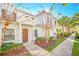 Front view of a charming two-story home with manicured landscaping at 2956 Lucayan Harbour Cir # 107, Kissimmee, FL 34746