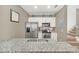 Granite countertops and stainless steel appliances highlight this modern kitchen at 2956 Lucayan Harbour Cir # 107, Kissimmee, FL 34746