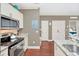 Modern kitchen features stainless steel appliances and granite countertops at 2956 Lucayan Harbour Cir # 107, Kissimmee, FL 34746