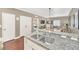 Open kitchen with granite countertops, stainless steel appliances, and a double sink at 2956 Lucayan Harbour Cir # 107, Kissimmee, FL 34746