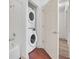 Convenient laundry closet with stacked washer and dryer at 2956 Lucayan Harbour Cir # 107, Kissimmee, FL 34746