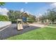 playground with slides, climbing structures, and a safe surface at 2956 Lucayan Harbour Cir # 107, Kissimmee, FL 34746