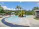 Refreshing swimming pool area with a fun water feature and lounge chairs at 2956 Lucayan Harbour Cir # 107, Kissimmee, FL 34746