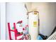 Mechanical room with water heater and holiday decor at 3128 Sandy Shore Ln, Kissimmee, FL 34743