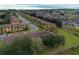 Aerial view of a community of tan and blue townhouses at 3428 Calabria Ave, Davenport, FL 33897