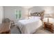 Cozy bedroom with a bamboo bed frame and window shutters at 3428 Calabria Ave, Davenport, FL 33897