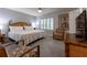Spacious Primary bedroom with king-size bed and sitting area at 3428 Calabria Ave, Davenport, FL 33897
