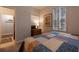 Charming bedroom with a queen-size bed and access to a private bathroom at 3428 Calabria Ave, Davenport, FL 33897