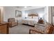 Spacious Primary bedroom with king bed and large mirror at 3428 Calabria Ave, Davenport, FL 33897