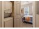 Convenient laundry room with stackable washer and dryer, located near a bedroom at 3428 Calabria Ave, Davenport, FL 33897