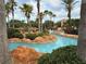 Scenic lazy river with lush landscaping, providing a tranquil experience at 3428 Calabria Ave, Davenport, FL 33897