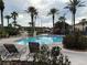Relaxing pool area with lounge chairs and palm trees, perfect for leisure at 3428 Calabria Ave, Davenport, FL 33897