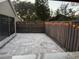 Private paved patio with string lights and wood fence at 371 Lexingdale Dr, Orlando, FL 32828