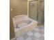 Bathroom with a garden tub and checkered floor at 371 Lexingdale Dr, Orlando, FL 32828