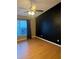 Bright bedroom with wood flooring and large window at 371 Lexingdale Dr, Orlando, FL 32828