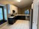 Modern kitchen with stainless steel appliances and white cabinets at 371 Lexingdale Dr, Orlando, FL 32828