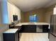 Modern kitchen with stainless steel appliances and white cabinets at 371 Lexingdale Dr, Orlando, FL 32828