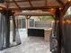 Outdoor kitchen with black cabinets and granite countertop at 371 Lexingdale Dr, Orlando, FL 32828