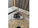 Stainless steel sink with granite countertop in outdoor kitchen at 371 Lexingdale Dr, Orlando, FL 32828