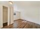 Simple bedroom with wood-look floors and a large closet at 4935 Sand Mountain Loop Rd, Auburndale, FL 33823
