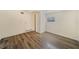 Bright bedroom with wood-look floors and ample natural light at 4935 Sand Mountain Loop Rd, Auburndale, FL 33823
