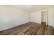 Well-lit bedroom featuring wood-look floors and a closet at 4935 Sand Mountain Loop Rd, Auburndale, FL 33823
