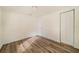 Spacious bedroom with wood-look floors and a closet at 4935 Sand Mountain Loop Rd, Auburndale, FL 33823