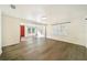 Spacious living area with wood-look floors and an open floor plan at 4935 Sand Mountain Loop Rd, Auburndale, FL 33823