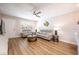 Bright living room featuring gray sofas, wood floors, and a coffee table at 5433 Lake Margaret Dr # 193, Orlando, FL 32812