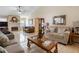 Spacious living room, featuring a fireplace and lots of natural light at 5556 Elizabeth Rose Sq, Orlando, FL 32810