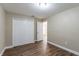 Spacious bedroom with double door closet and wood floors at 5711 Bolling Dr, Orlando, FL 32808