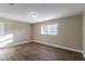 Spacious bedroom with hardwood floors and a large window at 5711 Bolling Dr, Orlando, FL 32808