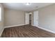 Bright bedroom with wood-look floors and ample closet space at 5711 Bolling Dr, Orlando, FL 32808
