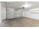 Attached garage with overhead door and storage shelves at 5711 Bolling Dr, Orlando, FL 32808