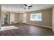 Open living area with hardwood floors and a view to the bathroom at 5711 Bolling Dr, Orlando, FL 32808