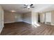 Bright living room with hardwood floors and access to other rooms at 5711 Bolling Dr, Orlando, FL 32808