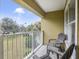 Private balcony with two chairs and view at 6403 Parc Corniche Dr # 4309, Orlando, FL 32821