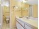 Bathroom with sink, toilet, and mirror at 6403 Parc Corniche Dr # 4309, Orlando, FL 32821