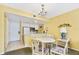 Small dining area with table and chairs at 6403 Parc Corniche Dr # 4309, Orlando, FL 32821