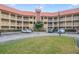 Two-story condo building with parking and landscaping at 6403 Parc Corniche Dr # 4309, Orlando, FL 32821