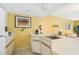 Condo kitchen with white cabinets and appliances at 6403 Parc Corniche Dr # 4309, Orlando, FL 32821
