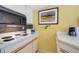 Condo kitchen with stove, microwave and counter at 6403 Parc Corniche Dr # 4309, Orlando, FL 32821