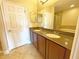 Bathroom with double vanity and granite countertop at 7580 Toscana Blvd # 834, Orlando, FL 32819