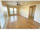 Spacious bedroom with hardwood floors and access to another room at 7580 Toscana Blvd # 834, Orlando, FL 32819