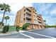 Multi-story building with parking and landscaping at 7580 Toscana Blvd # 834, Orlando, FL 32819