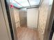 Clean and well-maintained elevator interior at 7580 Toscana Blvd # 834, Orlando, FL 32819