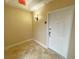 Residential entryway with tiled floor and white door at 7580 Toscana Blvd # 834, Orlando, FL 32819