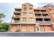 Exterior view of building with brick and balconies at 7580 Toscana Blvd # 834, Orlando, FL 32819